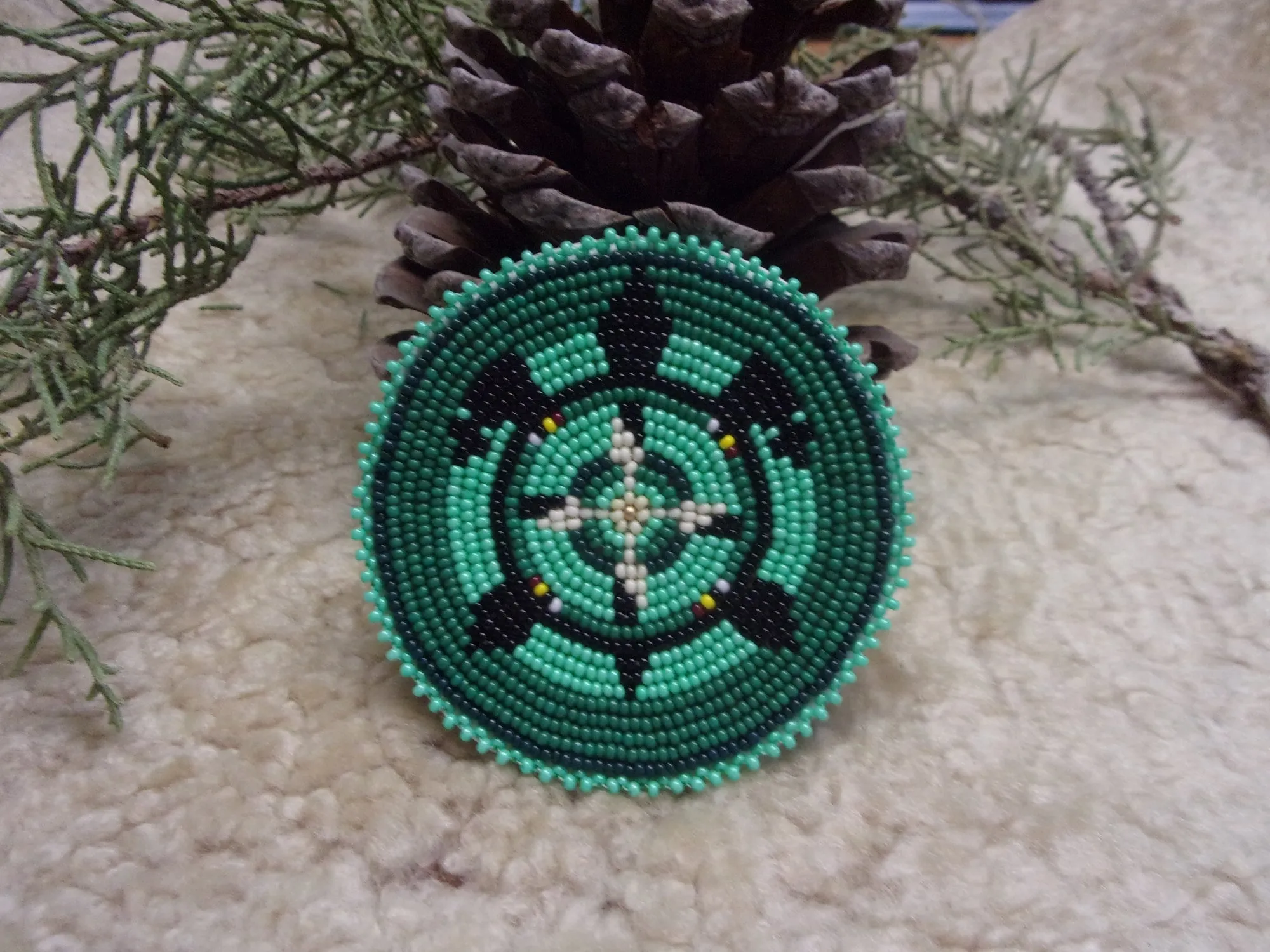 Fringed leather tote with beaded turtle