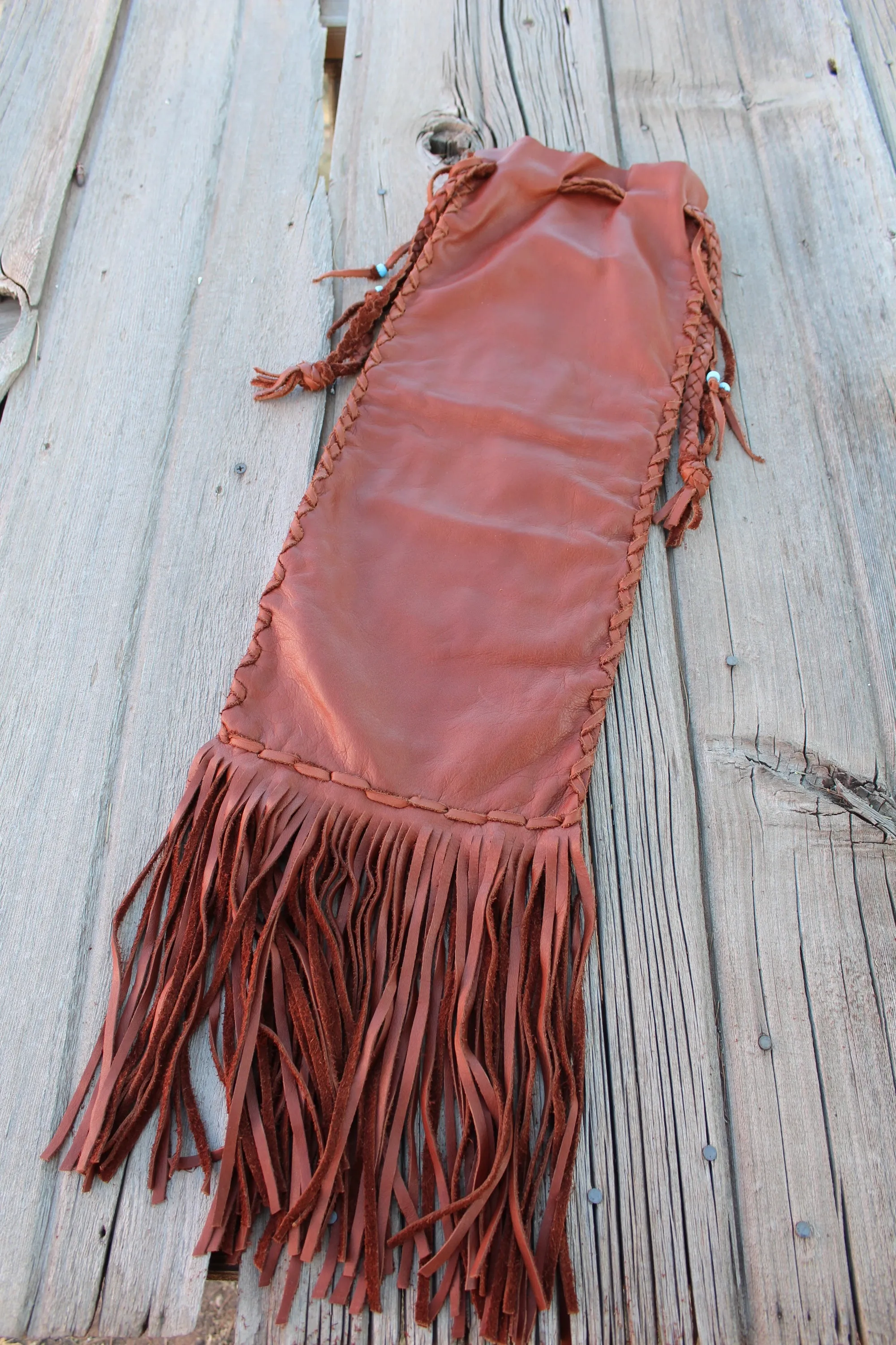 Fringed pipe bag, leather chanupa bag