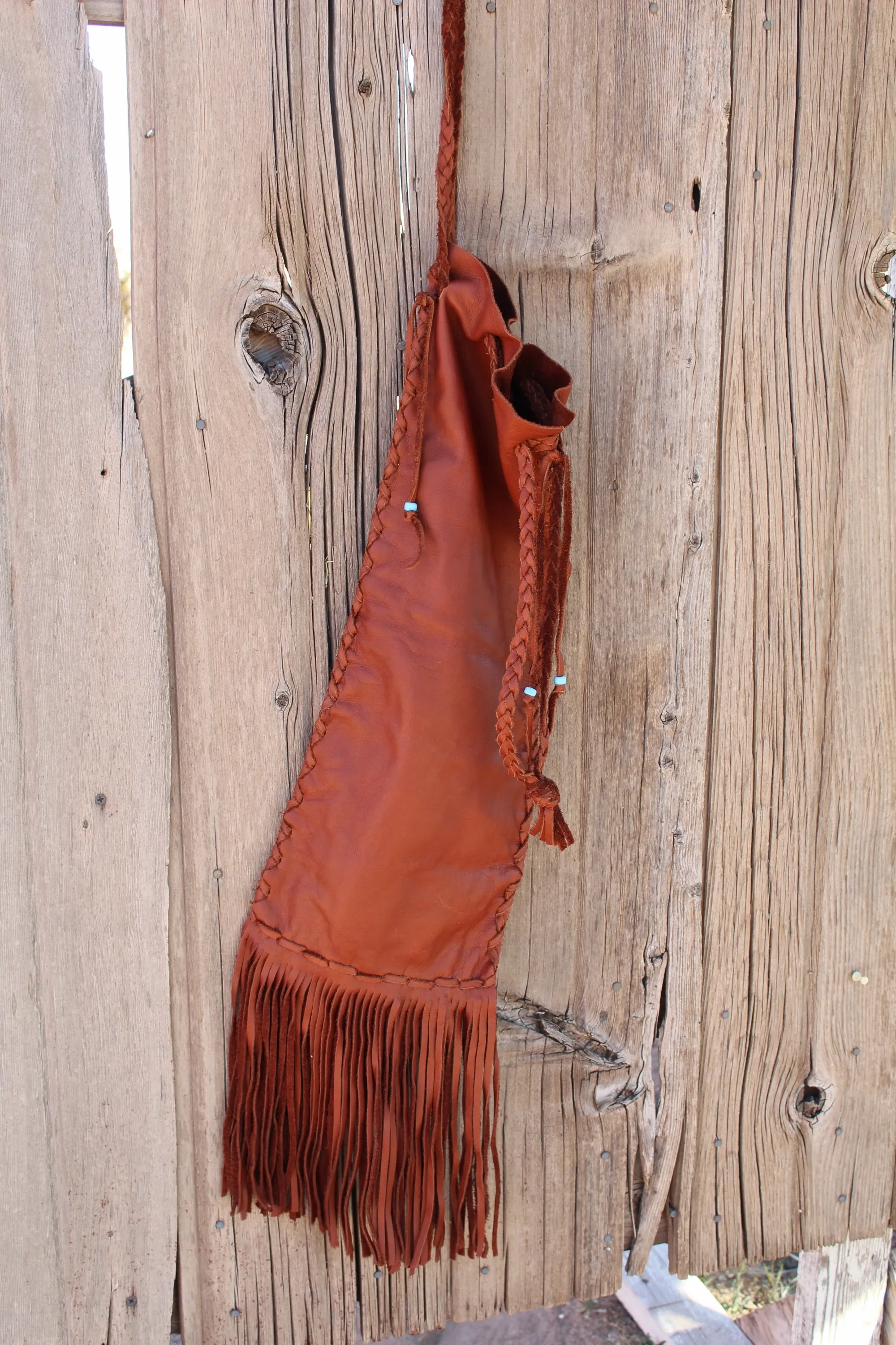 Fringed pipe bag, leather chanupa bag